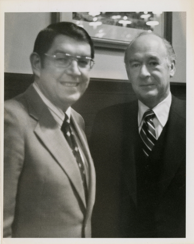 Photo Description: Idaho governors John V. Evans and Cecil D Andrus are posing for a picture.