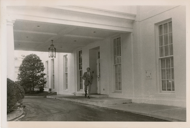 Photo Description: Ben J. Plastino is leaving the white house through an entrance for newspaper editors briefing. Text back translation "White House entrance for newspaper editors briefing that Ben J. Plastino attended" Notes read on back "Page E-1 Sunday Washington, D.C. _ this is front 3x4 86"