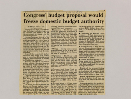 A newspaper article discussing: The Council of State Governments (CSG) believes the House and Senate budget plans are better for states than the president’s proposal since they focus cuts on Social Security and defense instead of state programs. Both plans reduce or freeze funding for healthcare, education, agriculture, and transportation, with the Senate making larger cuts. Despite these reductions, the federal deficit is still expected to be $180 billion in 1986.