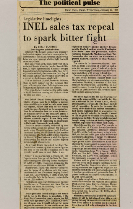 A newspaper article detailing the partisan fight over INEL contractor tax exemptions. With Governor Evans staying out of the bill until more figures are released, also considering the political impact of angering Eastern Idahoan voters.
