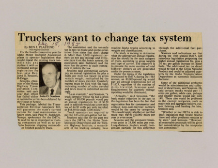 A newspaper article discussing proposed changes to the Truck tax system shifting a per mile driven tax to an increased registration fee. This is designed to limit the amount of tax evasion and potential retaliation from states that don't have that tax.  Image labeled "John O. Sessions"