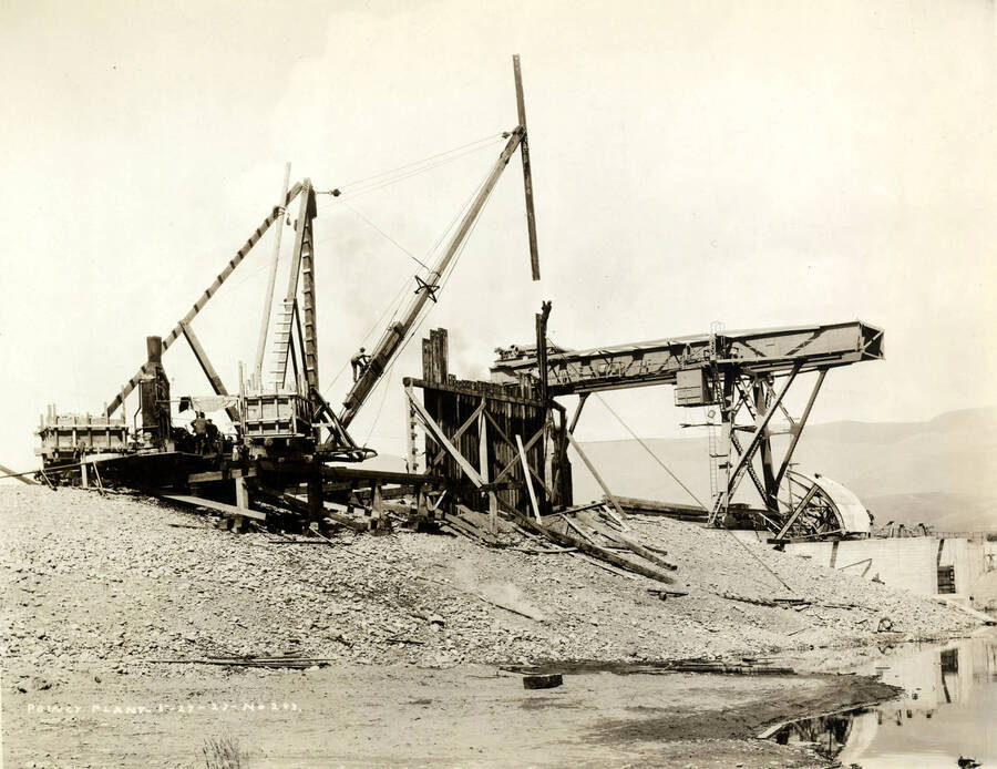 A crane is use to help construct the power plant at the Lewiston Mill. Written on the photograph is 'Power Plant. 5/27/1927 No. 263.'