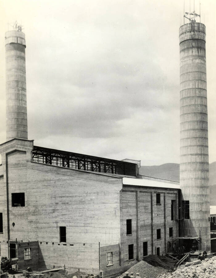 Two stacks stand behind one of the buildings under construction at the Lewiston Mill.