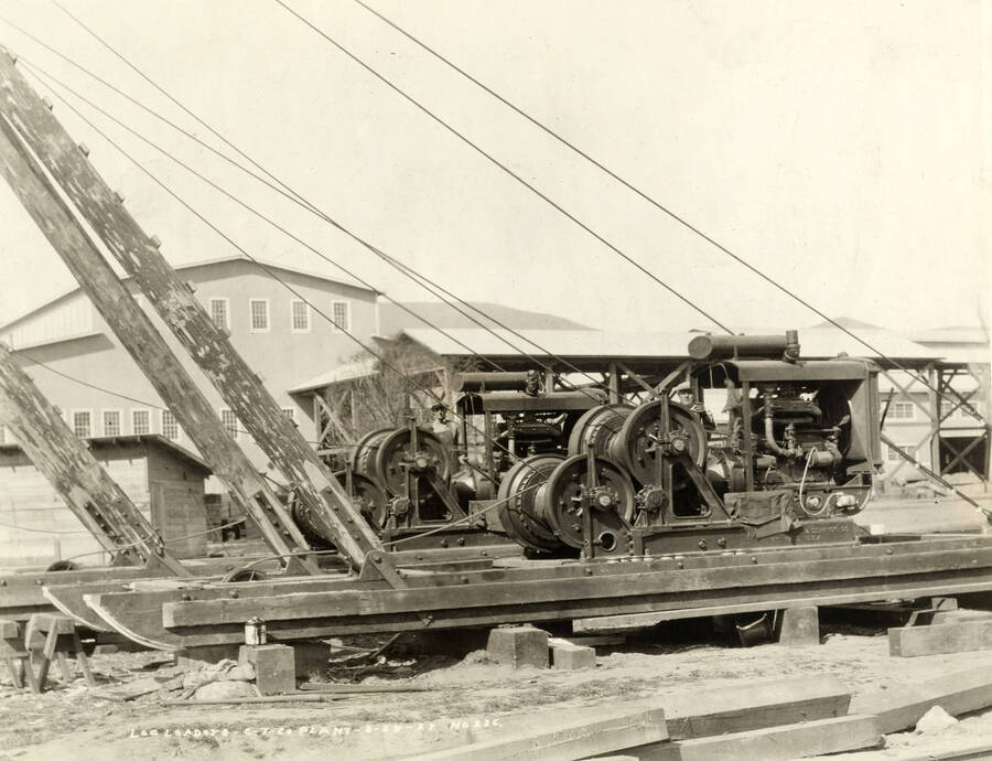According to the description written on the photograph ('Log loaders, CT CO Plant 3/28/1927 No. 236'), these are log ladders machines.