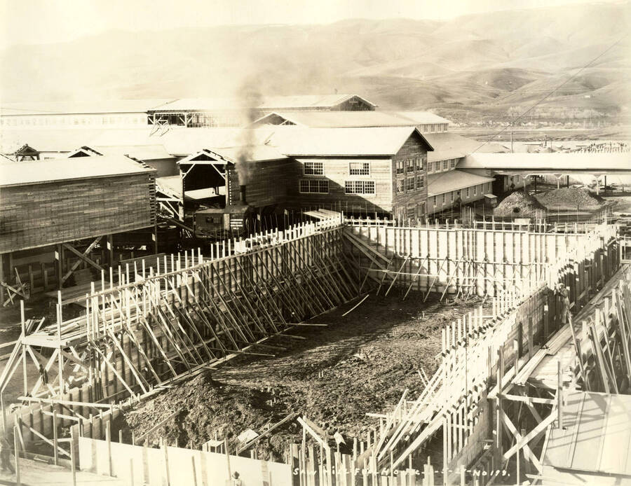One of the buildings at the Lewiston Mill under construction. Written on the photograph is 'Saw Mill Full House 5/21/1927 No. 198.'