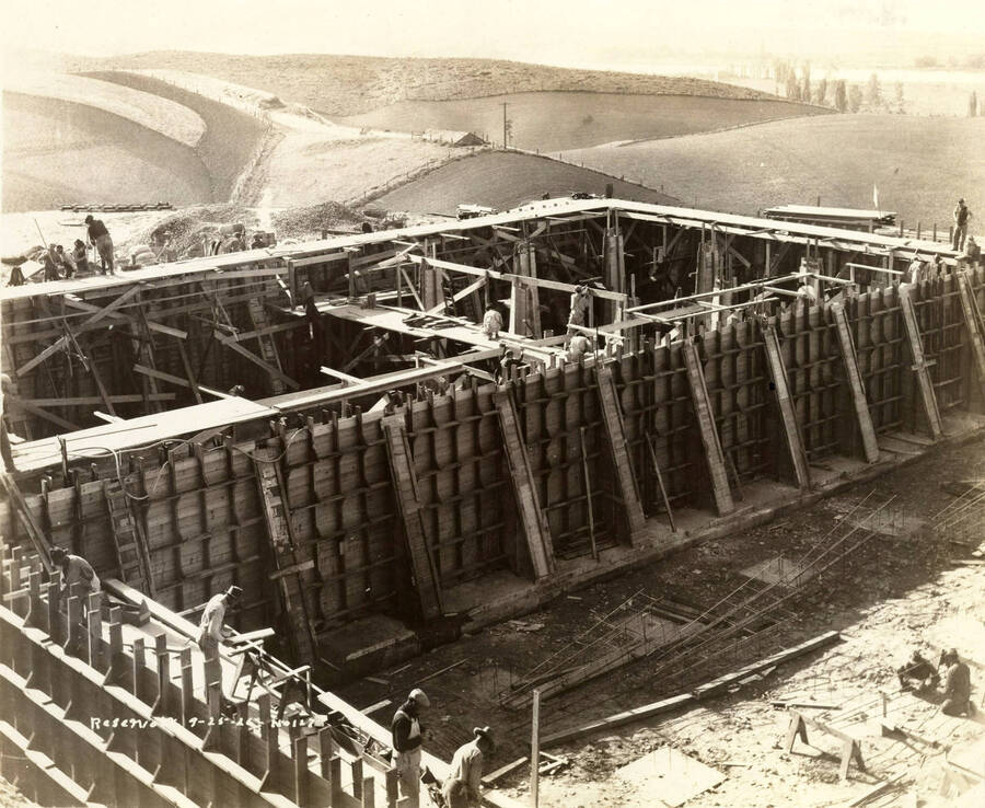 Men work on the framing for the reservoir. Written on the photograph is 'Reservoir 9/25/1926 No. 127'