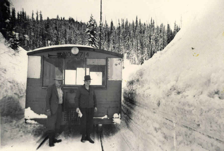 Woods Auditor Clarence Haeg and clerk Clayton Reed in front of the Camp 14 speeder on its last trip from 14 to Headquarters prior to closing the camp because of too much snow.'