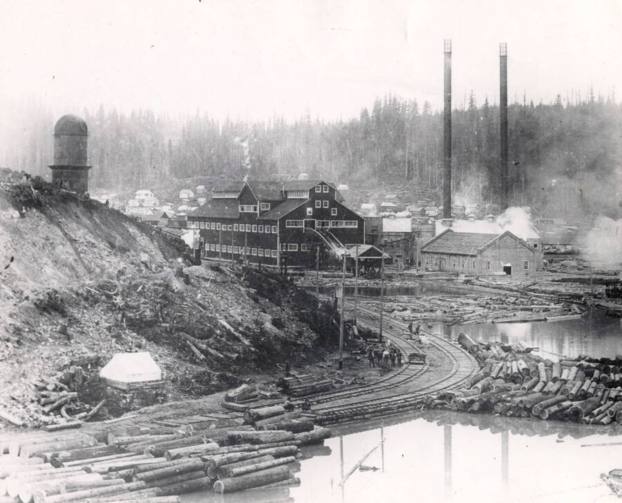 Viewing the Elk River mill about 1912. In the center of the photograph is where the logs would enter the mill. Also in view is the log ponds and the railroad tracks where the logs would be unloaded.