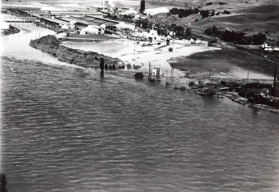 The flooding of the Clearwater surround the mill in Lewiston. The mill can be seen in the background