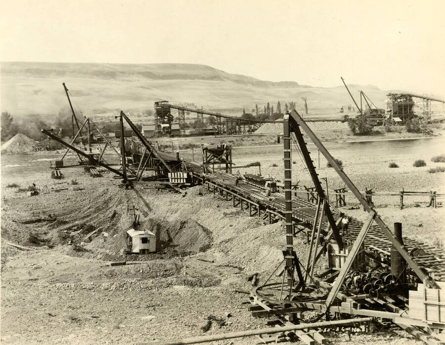 Several cranes work to build what looks to be the Lewiston Dam. Written on the photograph is '7/20/1926 No. 81'