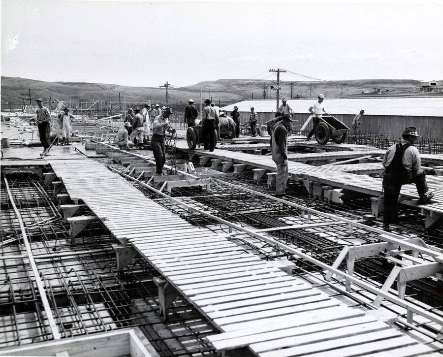 Men work on the roof of the Clearwater paper mill plant