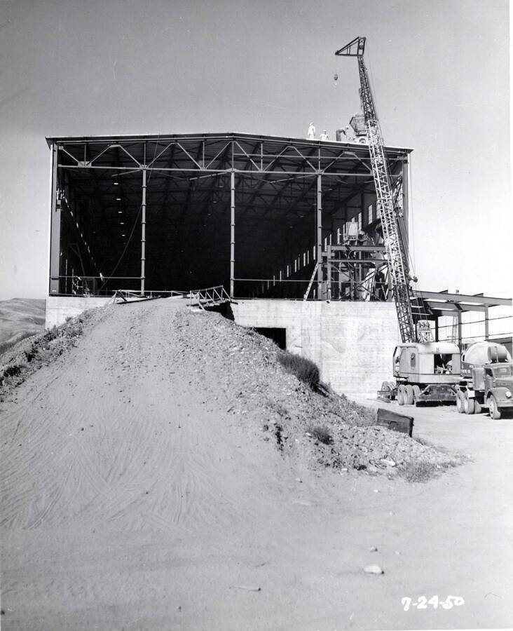 A makeshift road leads to the second floor of the building under construction at the Clearwater paper mill. A crane hoists materials to the roof on the right-hand side of the picture