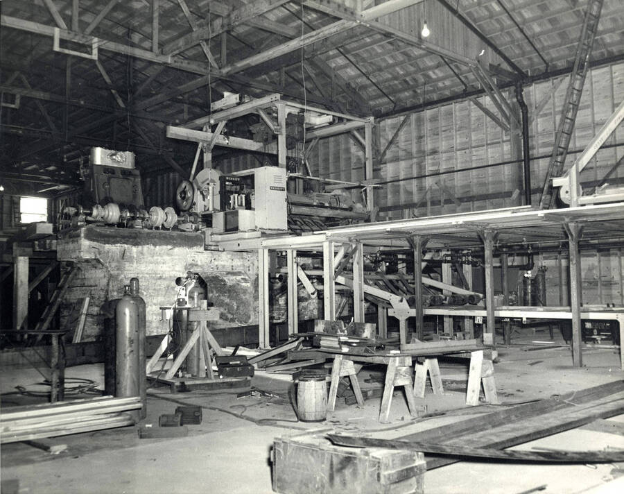 Photograph shows part the sawmill process.