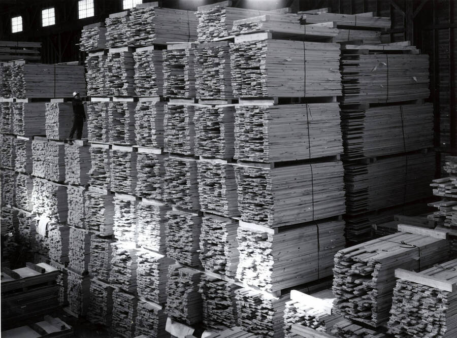 Bundles of wood are stacked high in the Clearwater Paper Mill warehouse.