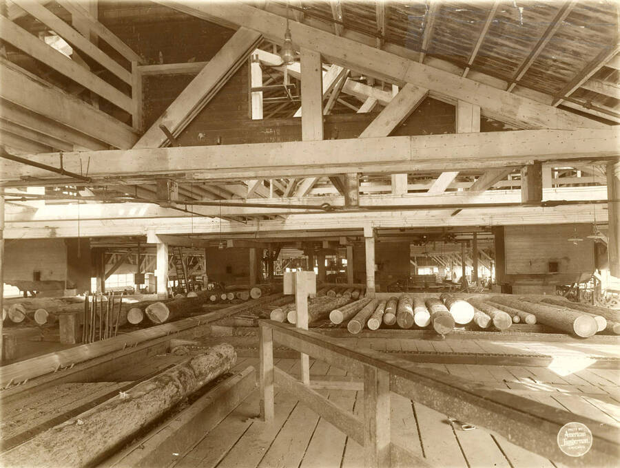 Another view from further back, with railing around cut off saws.' (Description taken from American Lumberman papers found within the folder) Photograph taken between September 28 and October 4.