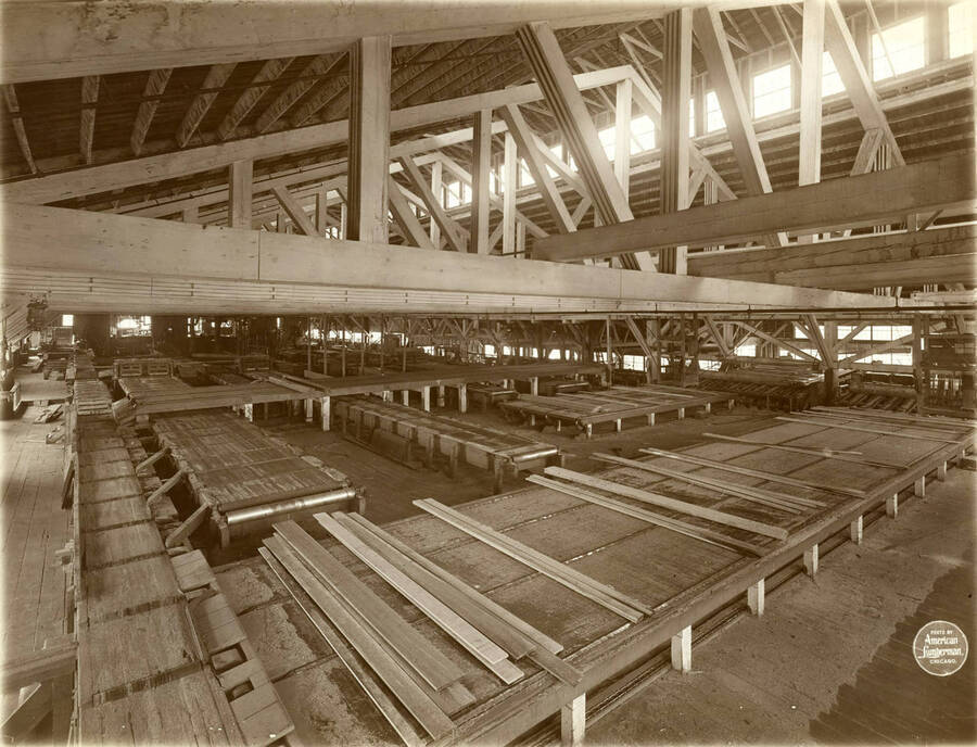 Interior of saw mill from stairway in N. W. corner, with a very wide angle to show the entire equipment.' (Description taken from American Lumberman papers found within the folder) Photograph taken between September 28 and October 4.