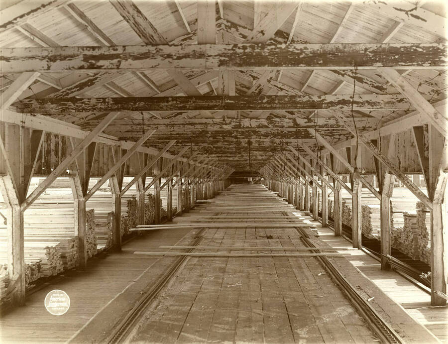 Interior of the long sorting shed, 544 feet from outside.' (Description taken from American Lumberman papers found within the folder) Photograph taken between September 28 and October 4.