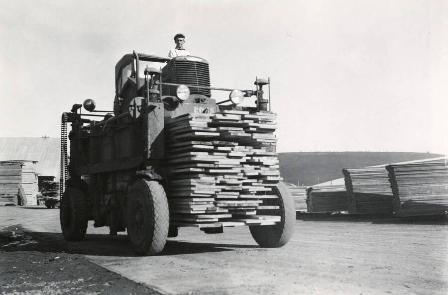 Lumber stacked on a fork lift truck.