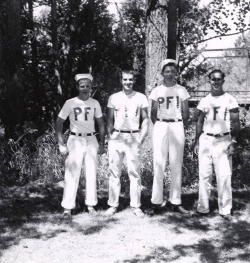 Four boys wearing P.F.I. tee shirts