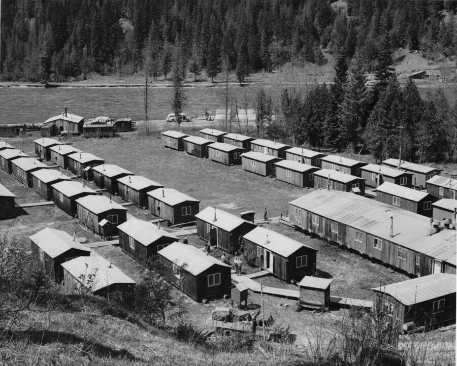 The bunkhouses and main building of CampT3 on the North Fork of the Clearwater River. The men here are in preparation for the 1965 log drive.