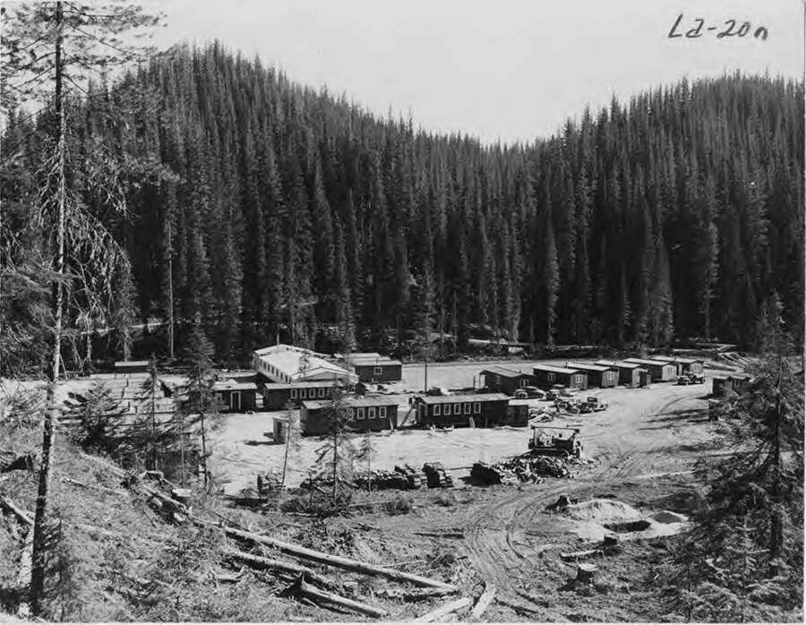 Description from the photograph reads "New Camp 60, W. Side Washington Creek. Old CP 60 on E side - lodge Creek or could be old CP60 was car camps (see photo) and this camp prefabs replaced cars." The bunkhouses shown are more permanent than the railroad cars that were previously used.