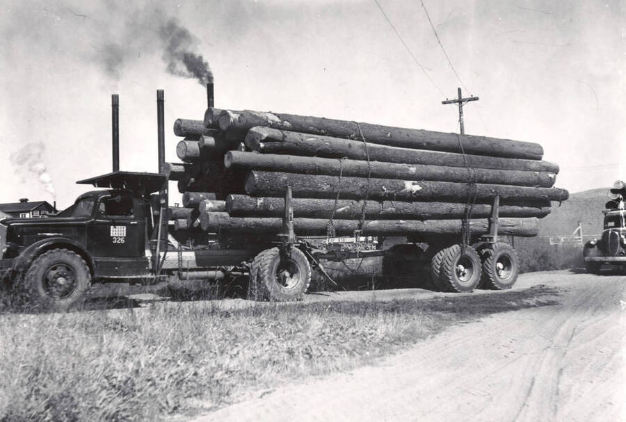 A fully loaded logging truck arriving at the mill.