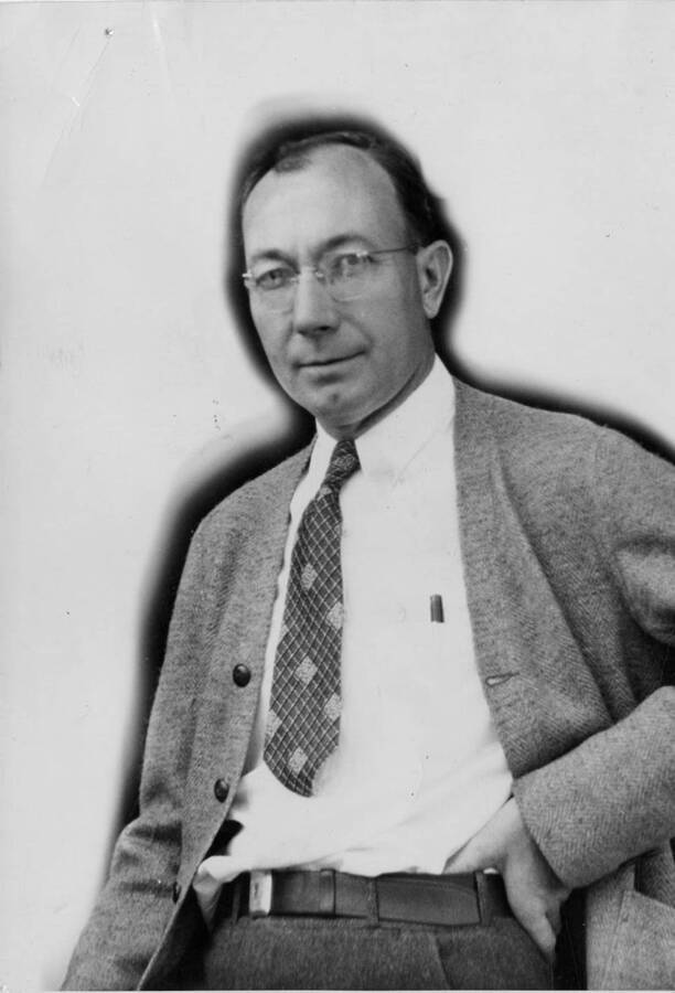 Portrait of Robert 'Bob' T. Bowling, who, according to the description on the back of the photograph, invented the Pres-To-Logs machine.