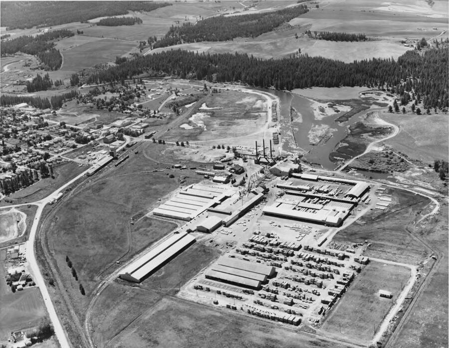 An aerial photograph of the Potlatch mill. To the left of the mill is the town itself.