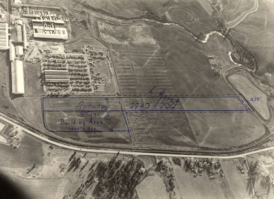 Aerial view of the mill with the proposed location of a runway drawn in ink.