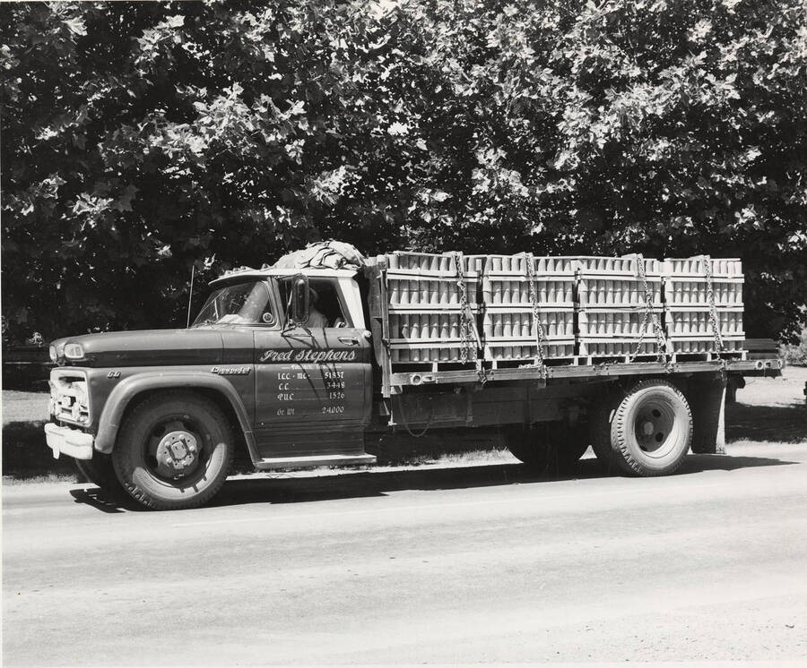 A truck loaded with pres-to-logs makes its way to Potlatch for delivery.