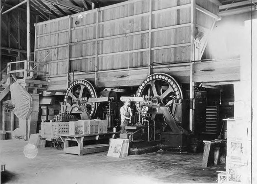 A worker operates a pres-to-log machine in Lewiston, Idaho.