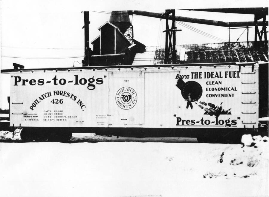 A railcar used to transport Pres-to-Logs is also used to advertise them. This car, one side says where the logs are made, while the other gives reason why a person should buy them.