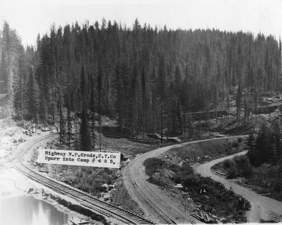 Highway N.P. Grade C. T. Co (Clearwater Timber Co), spur into Camps 4 & 5. The bridge that can be seen through the trees in the background is over a creek (most likely Corbett Creek).