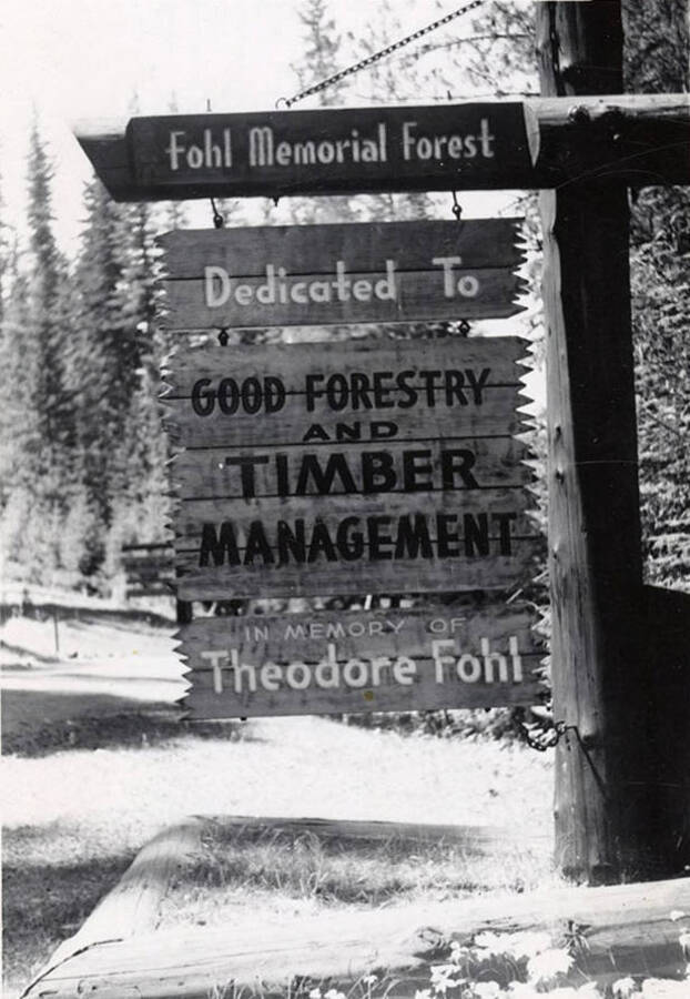 A sign for the Fohl Memorial Forest (now Fohl Picnic area) that says 'dedicated to good forestry and timber management. In memory of Theodore Fohl.'