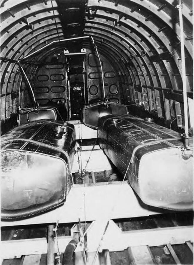 Interior of Douglas plane showing arrangement of tanks. Improper adjustment of equipment on first flight nearly filled the cabin with spray.