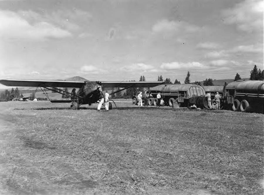 Tank trucks were borrowed from the Air Corps to transport spray mixture from Moscow, Idaho to the various landing fields. The units were set up to form a service island on either side of which planes were given quick refueling and refilling of spray tanks.