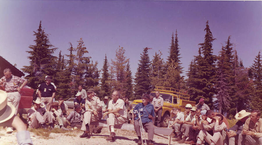 Men gather on Bertha Hill for the land board meeting.