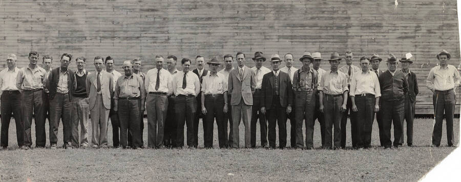 A group of foreman for Potlatch pose for a photo. They are as listed, according to the roster included with the photograph, 'front row left to right' : H. Thompson (Buiguette Plant), C. Harris (Pond), H. L. white (?), A. Jensen (Calender), L. Williams, W. A. Fredenberg, T. Sherry, G. S. Porfee (?), J. H. Ferish (?), K. Ross, W. Yoelum (?), C. Cunningard, A. McLeod.