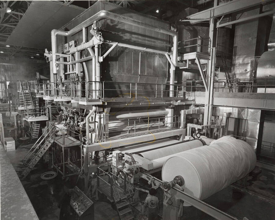 Photograph of the machine that puts paper products on to large rolls.