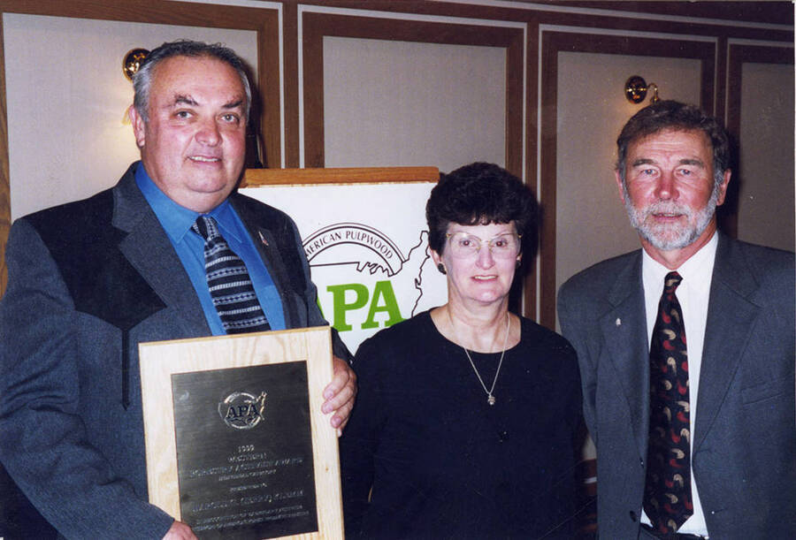 Left to right: Jerry and Pat Klemm receive an award from Ron Wetmore who is the APA [American Pulpwood Association] Western Division chairman.