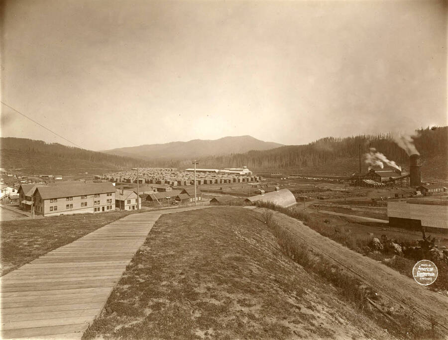 Entire plant of the Elk river operations from hospital, showing from hotel to saw mill. The building on the left-hand side of the picture is the hotel. Description taken from American Lumberman papers found within the folder. Photograph taken between September 28 and October 4.
