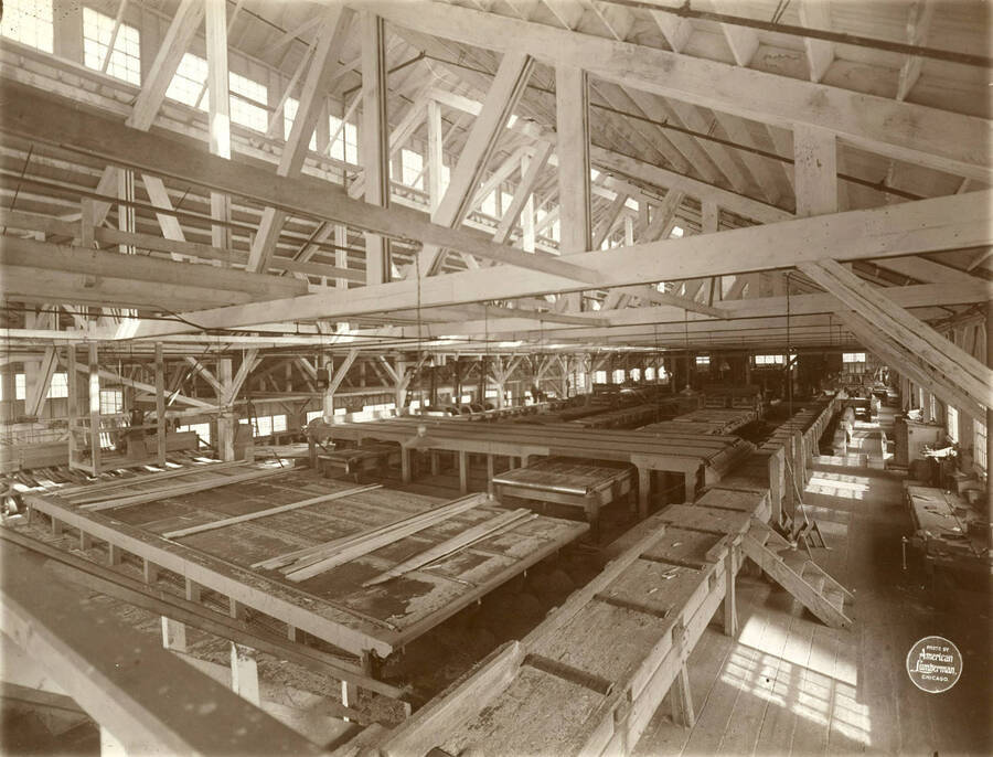 Interior of saw mill from back end, showing entire interior. Description taken from American Lumberman papers found within the folder. Photograph taken between September 28 and October 4.