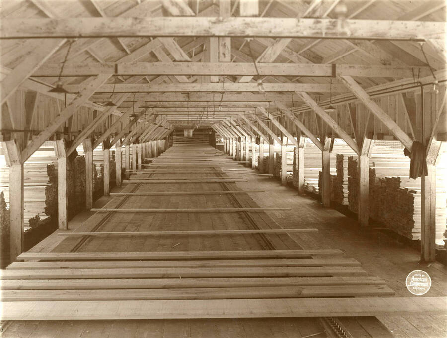 Interior of sorting shed from outer end. Description taken from American Lumberman papers found within the folder. Photograph taken between September 28 and October 4.