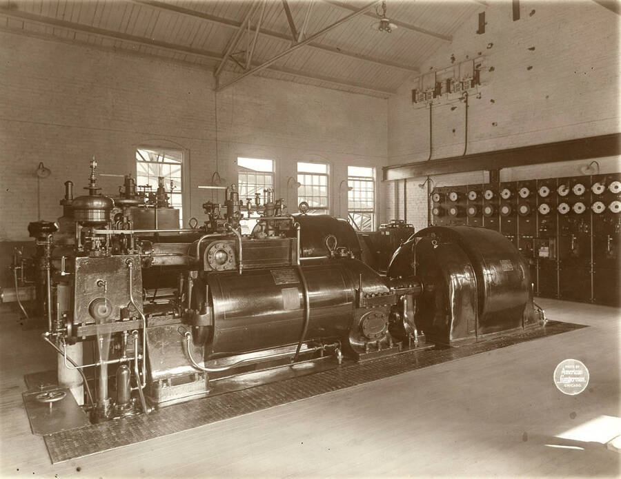 Two Westinghouse-Parsons steam turbines and Dynamos and switch board. 625 K. W. 603 AMP; and 1000 KW, 963 AMP. Description taken from American Lumberman papers found within the folder. Photograph taken between September 28 and October 4.