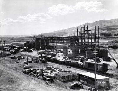 Construction of the Clearwater paper mill plant. Shown is part of the piping structure as well as construction materials in the foreground.