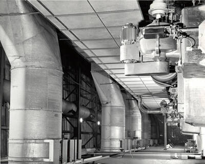 Machinery inside the Clearwater Paper Mill plant. On the back of the photograph, it is stamped with the studio name: Bill Jones Photography 6311 S.W. Wilbard St. Portland 19 Oregon. CH 4-4943