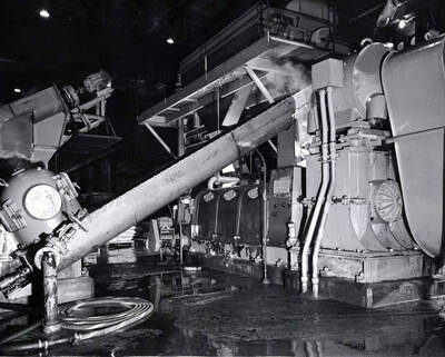 Machinery inside the Clearwater Paper Mill plant. On the back of the photograph, it is stamped with the studio name: Bill Jones Photography 6311 S.W. Wilbard St. Portland 19 Oregon. CH 4-4943.
