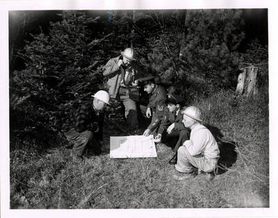 Civilian Ground Observer Training at PFI Men study a man in preparation for airplane observation.