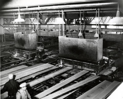 Planks are run through the edger machine.