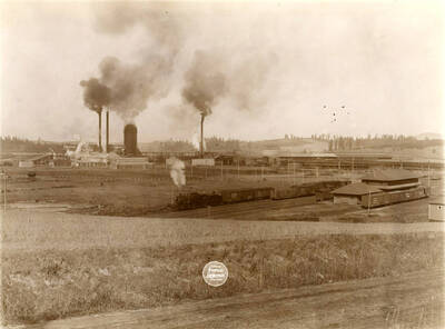 Plant from 5th and Pine sts., showing depot. (Description taken from American Lumberman papers found within the folder) Photograph taken between September 28 and October 4.